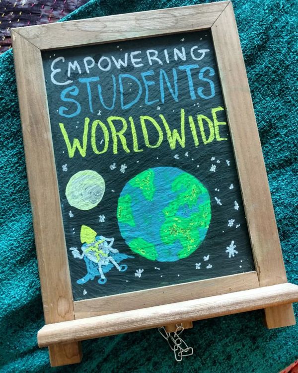 Chalkboard: Empowering Students Worldwide in green, with a glowing Earth and a little astronaut.