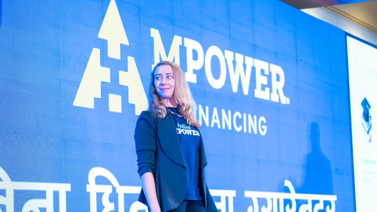 Claire Almand on stage at an education and career summit in Kathmandu